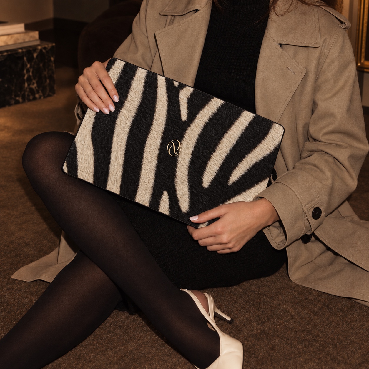Bella Nota Zebra MacBook case styled as a fashion accessory