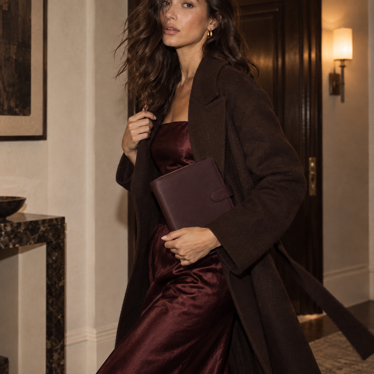 Woman styled with a black cherry Bella Nota A5 planner
